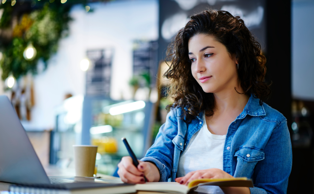 Woman looking at laptop.